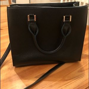 Handbag that has 2 sections and center zip.  Optional crossbody strap